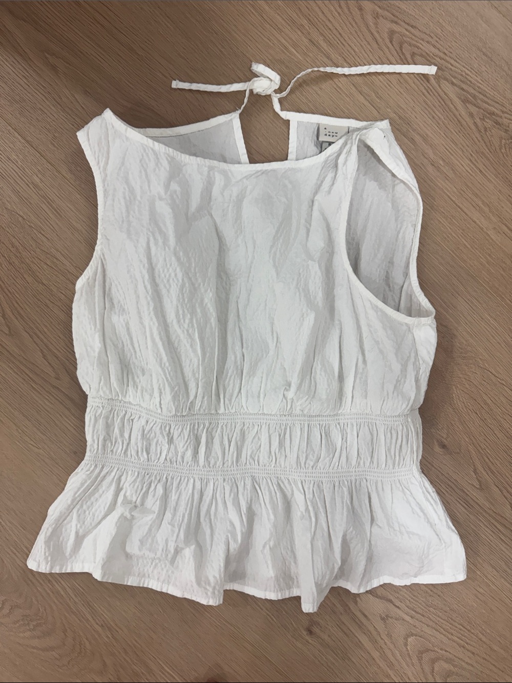 White Sleeveless Peplum Tie-Back Top